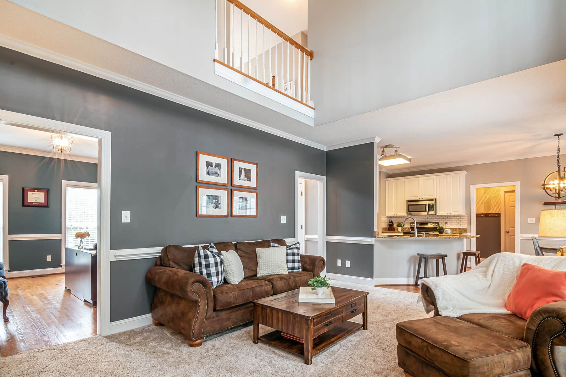 A large area rug anchoring a furnished living room