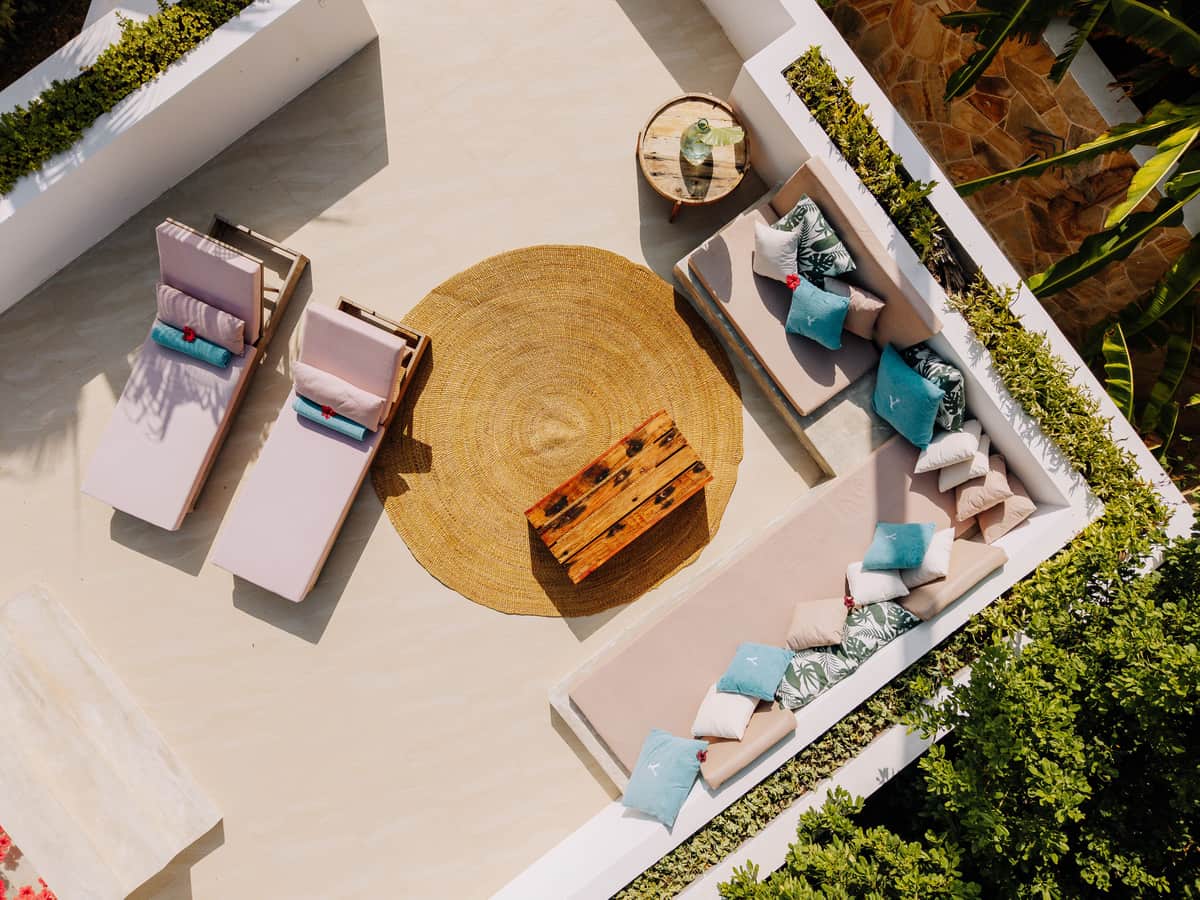 A flatwoven outdoor rug on a patio with furniture