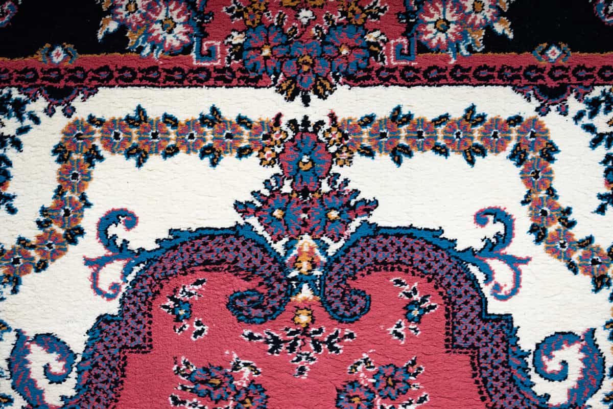 A traditional medallion-pattern rug with faded colors