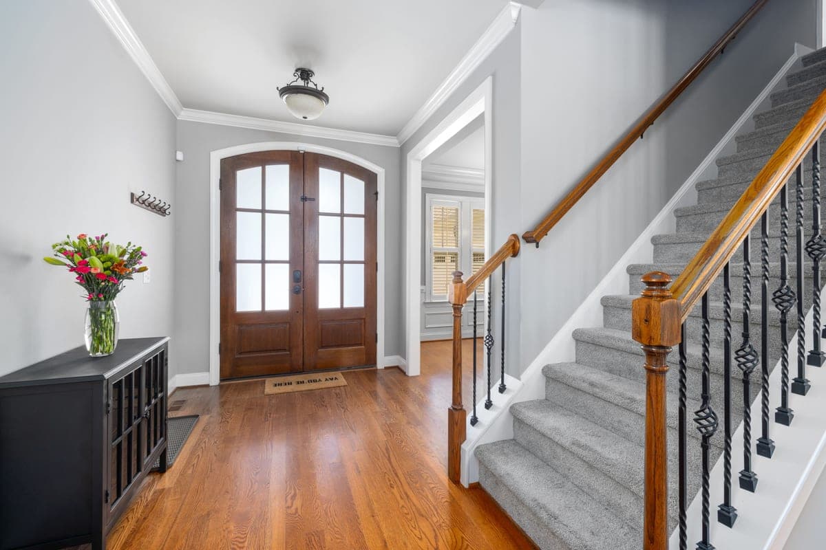 A carpet runner fitted to a wooden staircase